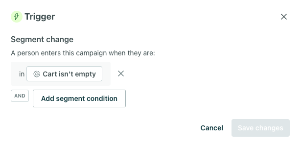 Under 'what triggers a campaign?' select 'when a person moves in or out of a segmenet.` Then define the trigger as the segment `Cart Exists.`