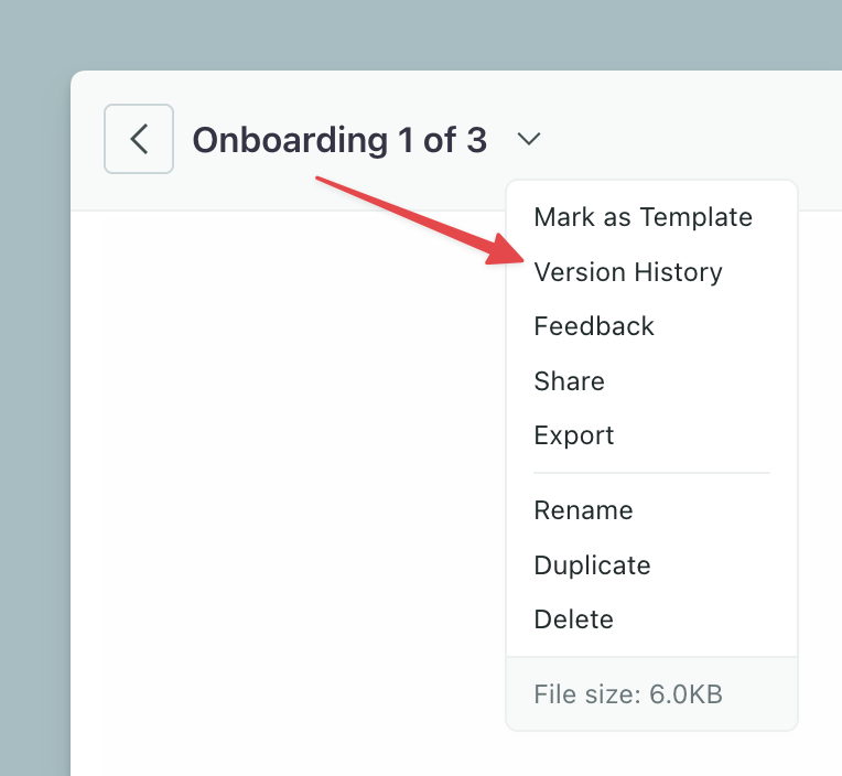 The top-left of the Design Studio editor. A dropdown menu with an arrow pointing to the Version History option.